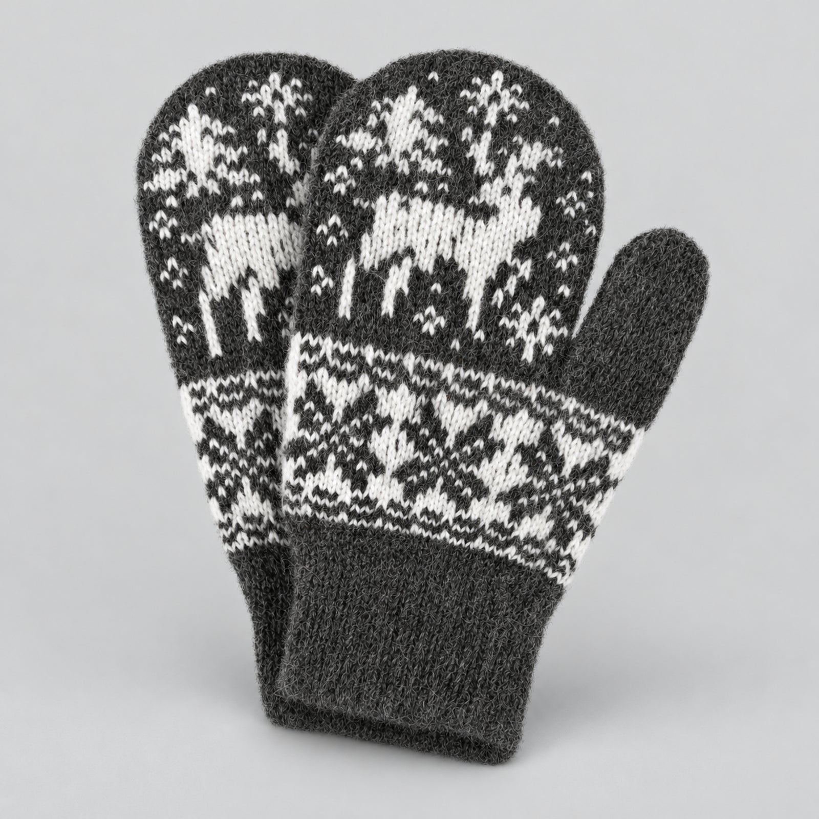 A pair of dark gray knit winter mittens with a white Fair Isle pattern featuring reindeer and snowflakes, displayed on a neutral light gray background.