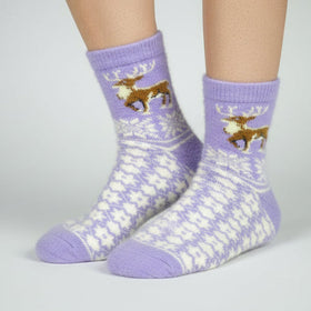 Purple socks with dog illustrations on a neutral background