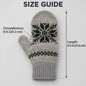 A gray knit mitten with a black snowflake pattern and a black horizontal stripe near the cuff, shown on a light gray background with measurement labels and arrows indicating circumference 8 in (20.3 cm) and length 8.5