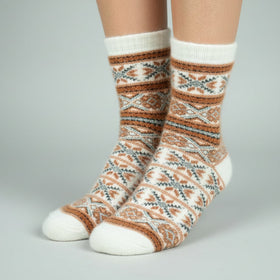 Patterned socks worn by a person on a gray background