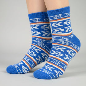 Blue patterned socks on a gray background