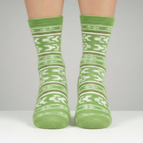 Green patterned socks on a plain background
