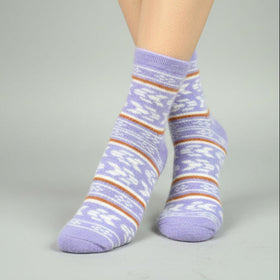 Purple striped socks worn by a person on a gray background