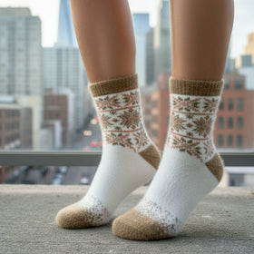 Person wearing white socks with brown patterns in an urban setting