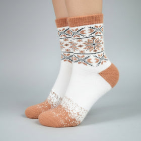 White socks with brown and patterned design on a gray background