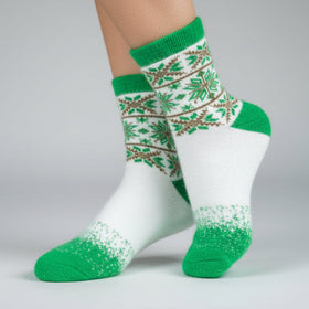 White socks with green and patterned design on a gray background