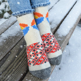 Colorful patterned socks worn outdoors on a snowy day