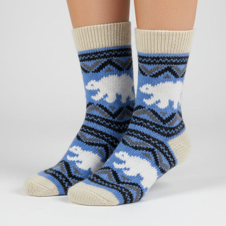 Knitted sock with polar bear design on a white background