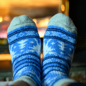Blue and white patterned socks with a blurred background