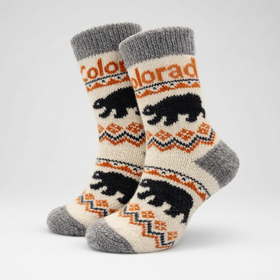 Pair of socks with bear design and 'Colorado' text on a white background