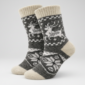 Pair of gray and beige patterned socks on a white background