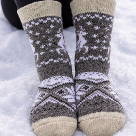 Pair of patterned socks worn in the snow