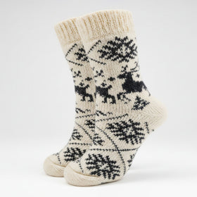 Pair of cream-colored socks with black pattern on a white background