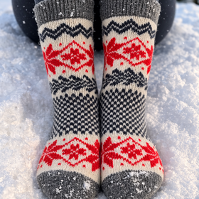 Person wearing patterned socks in the snow