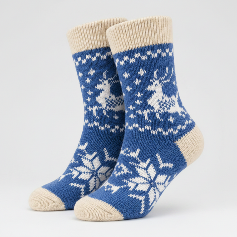 Pair of blue socks with white reindeer pattern on a white background