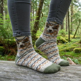 Person wearing socks with bear designs in a forest setting