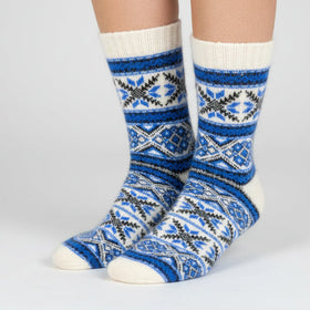 Blue and white patterned sock on a white background