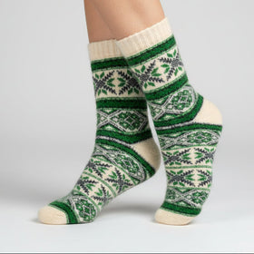 Green and white patterned sock on a white background