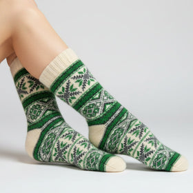 Green and white patterned sock on a white background