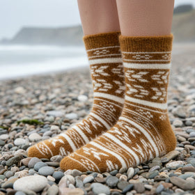 Brown and white patterned sock on a white background