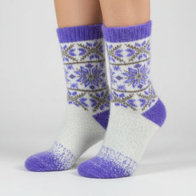 Floral patterned sock with purple accents on a white background