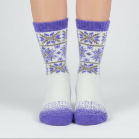 Floral patterned sock with purple accents on a white background