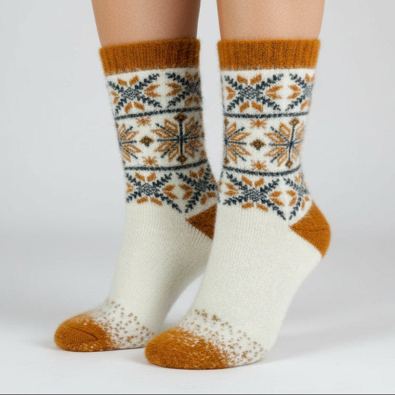 White sock with orange accents and a pattern on a white background