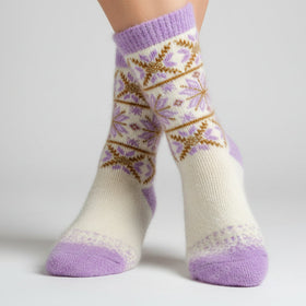 Knitted sock with a snowflake pattern on a white background