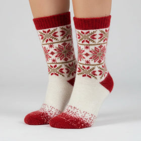 Knitted sock with red and white pattern on a white background