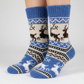 Knitted sock with deer pattern on a white background