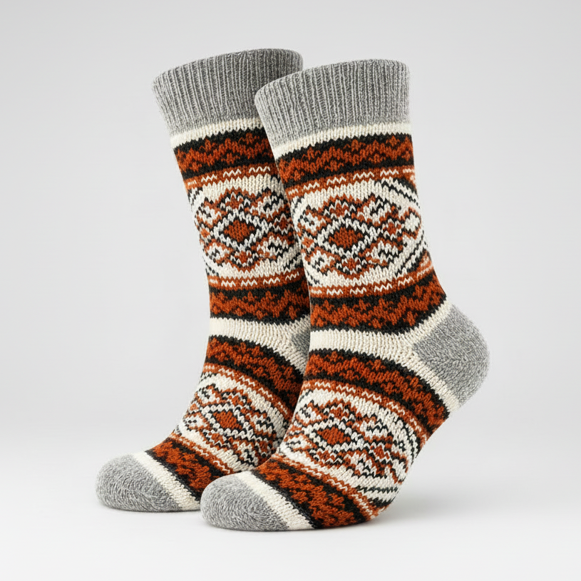 Pair of patterned socks with gray cuffs on a light grey background