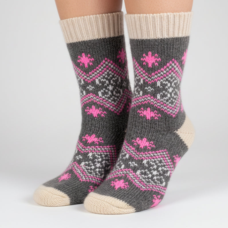 Gray sock with pink patterns on a white background