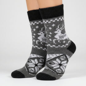 Gray sock with reindeer pattern on a white background