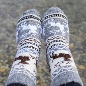 Pair of patterned socks on a blurred natural background