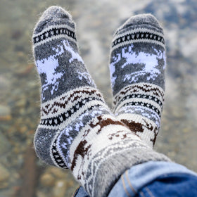 Pair of patterned socks with a blurred natural background